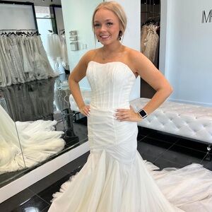 Wedding dress. NWT, never worn. Willing to negotiate price! Never altered.
